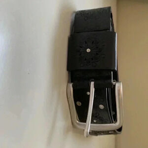 Source  Unknown faux leather belt w embossed floral motif and silver buckle
